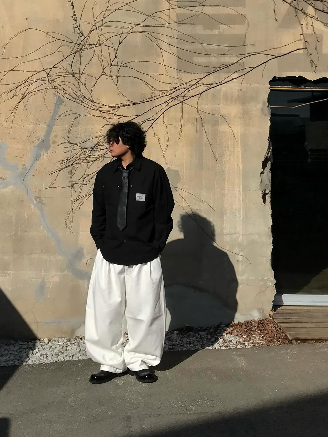 Photo shared by 오윤택/오태기 on February 13, 2026 tagging @ohtaeki_official. May be an image of standing, overcoat, sweatpants, sweatsuit and text.