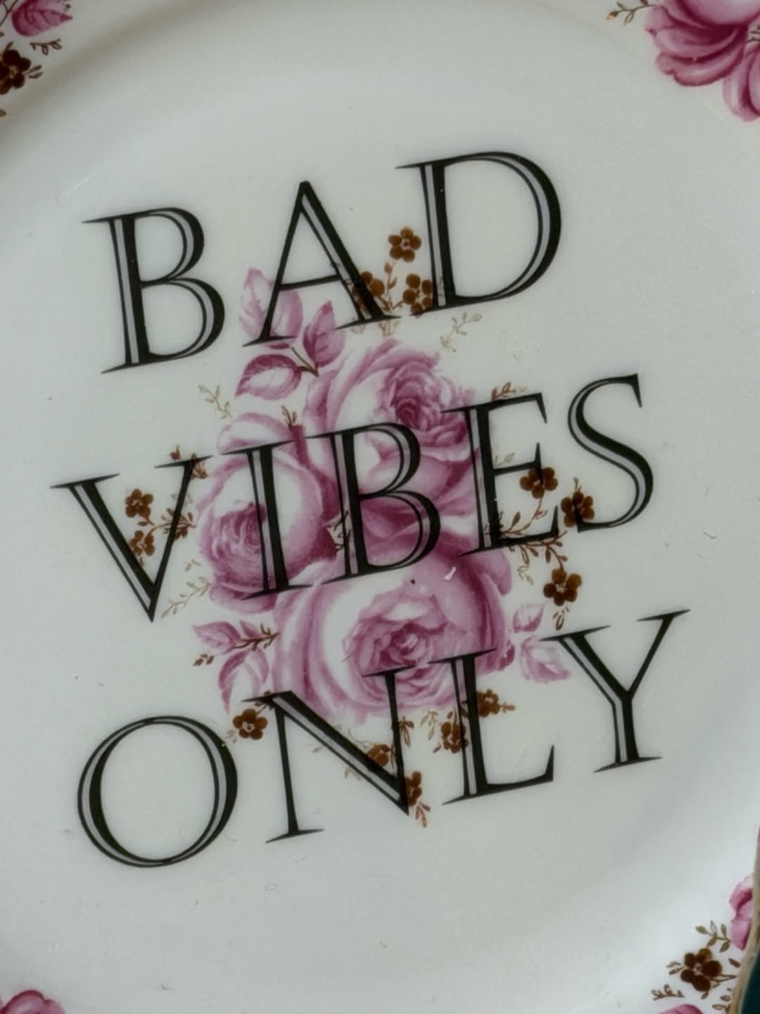 Photo by P1Harmony (피원하모니) on February 03, 2026. May be an image of saucer, platter, chinaware, plate and text that says 'BAD B AD WBES ES ONEY LY'.