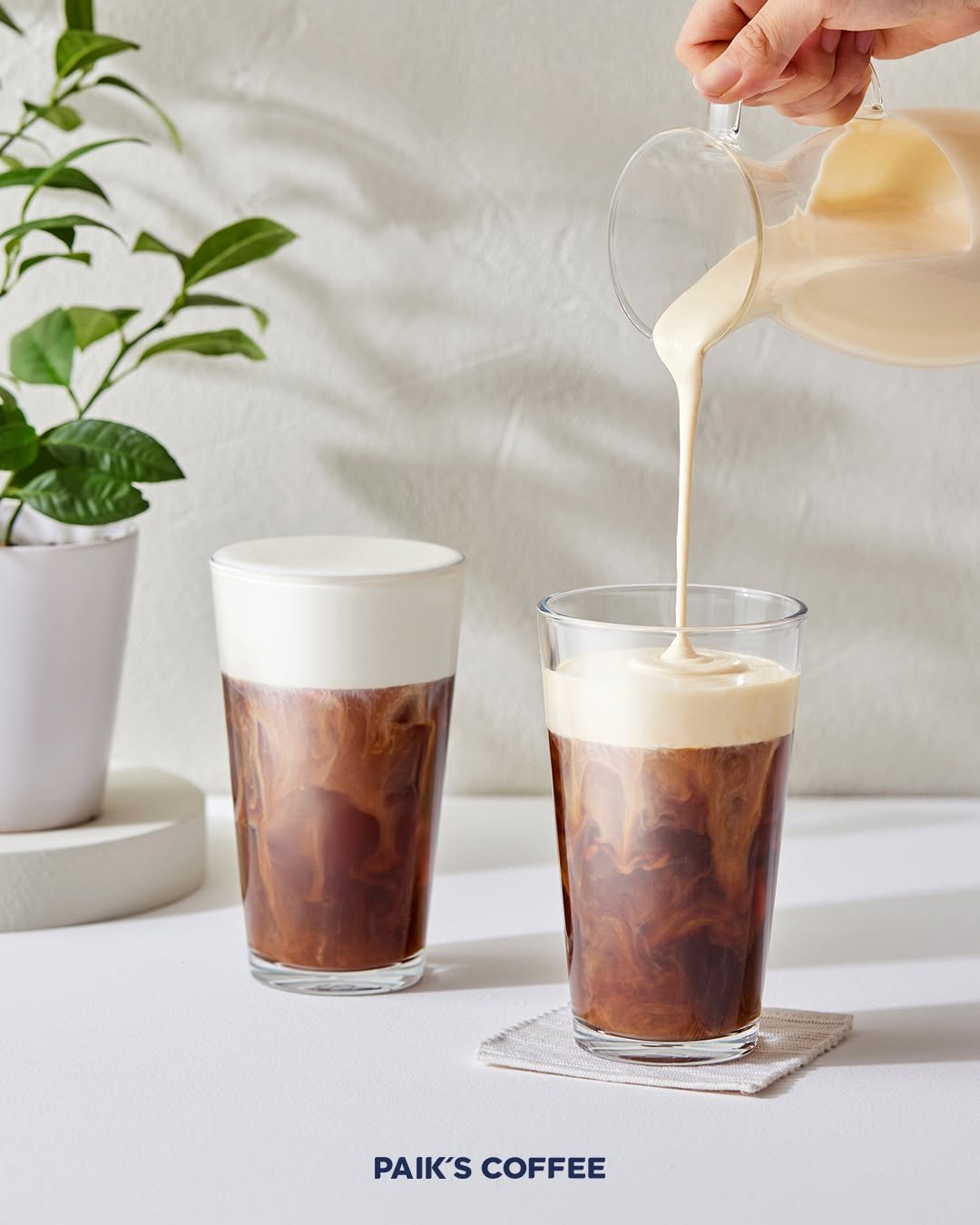 Photo by 빽다방 on October 23, 2025. May be an image of coffee cup, cappuccino and text that says 'PAIK'SCOFFEE PAIK'S COFFEE'.