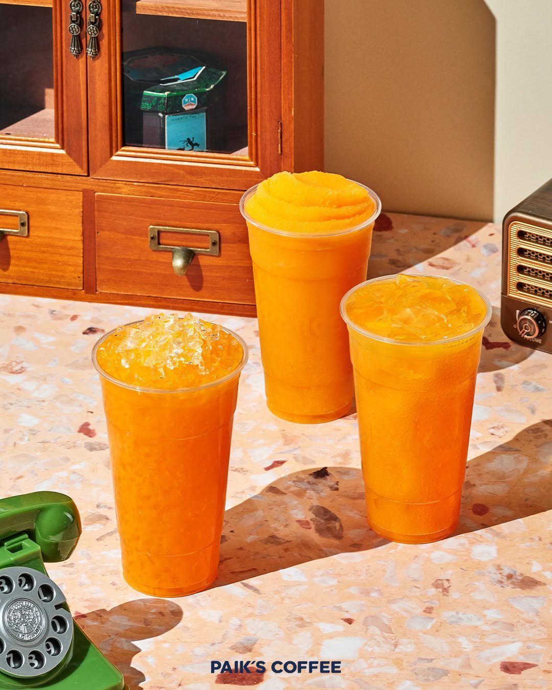 Photo by 빽다방 on August 25, 2025. May be an image of juice, smoothie, telephone and text that says 'テ មនន PAIK'SCOFFEE PAIK'S COFFEE'.