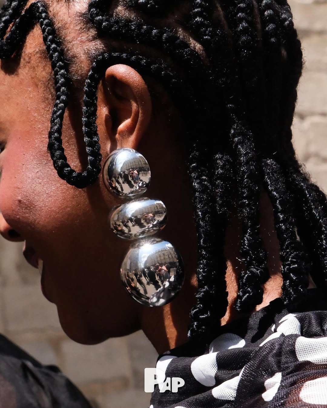Photo shared by PAP KOREA 팝 코리아 on July 01, 2025 tagging @parisfashionweek. May be an image of 1 person, braids and jewelry.