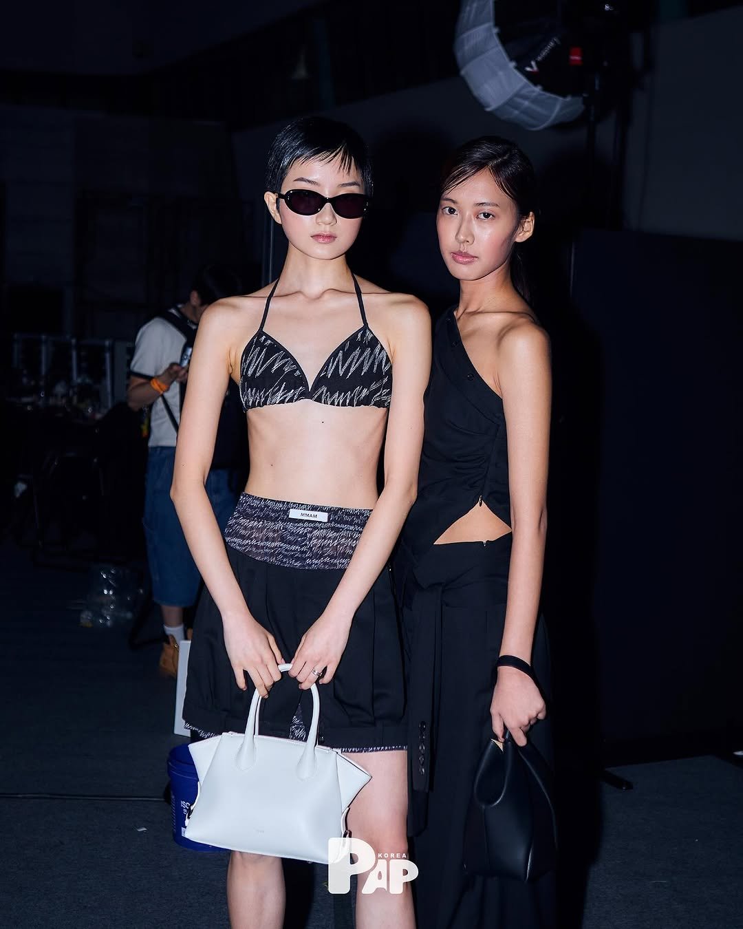 Photo shared by PAP KOREA 팝 코리아 on September 09, 2025 tagging @ch_a_ny, and @y3a3un_. May be an image of 3 people, makeup, purse and text.