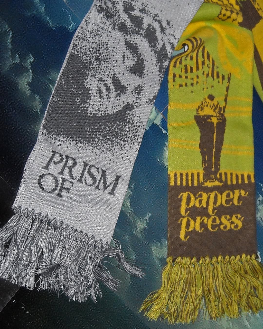 Photo shared by paper press on December 05, 2025 tagging @prismof_magazine. May be an image of scarf and newspaper.