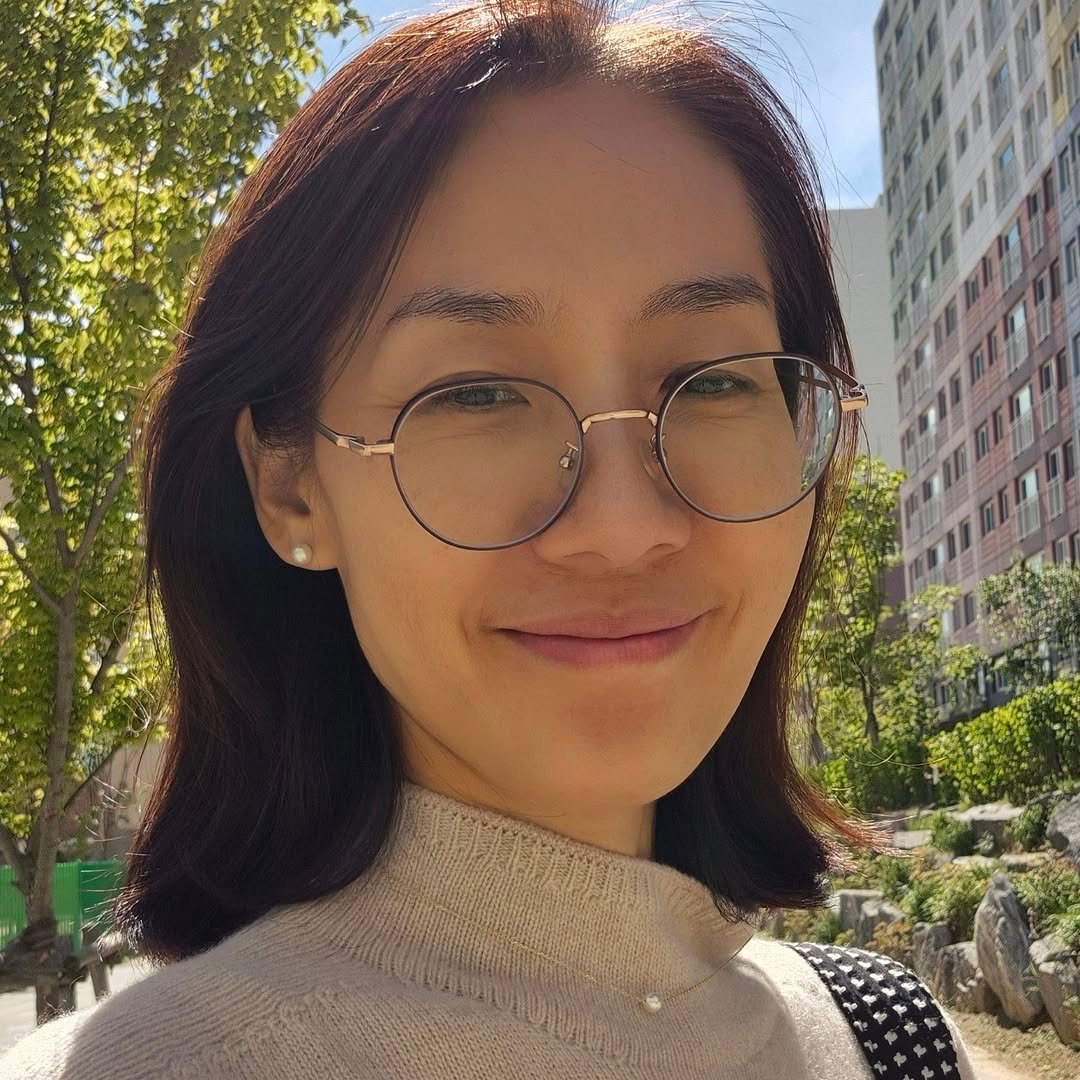 Photo by Ji Hye Park on September 26, 2025. May be a selfie of 1 person, eyeglasses, turtleneck, park and text.
