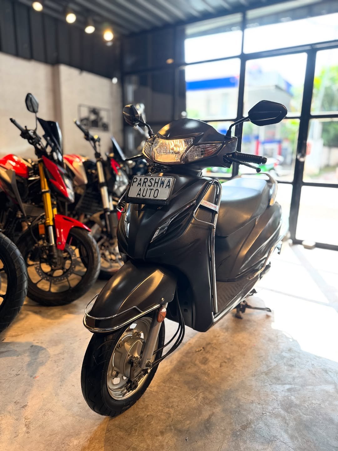 Photo by Parshwa Auto on August 30, 2025. May be an image of motorcycle, scooter and text.