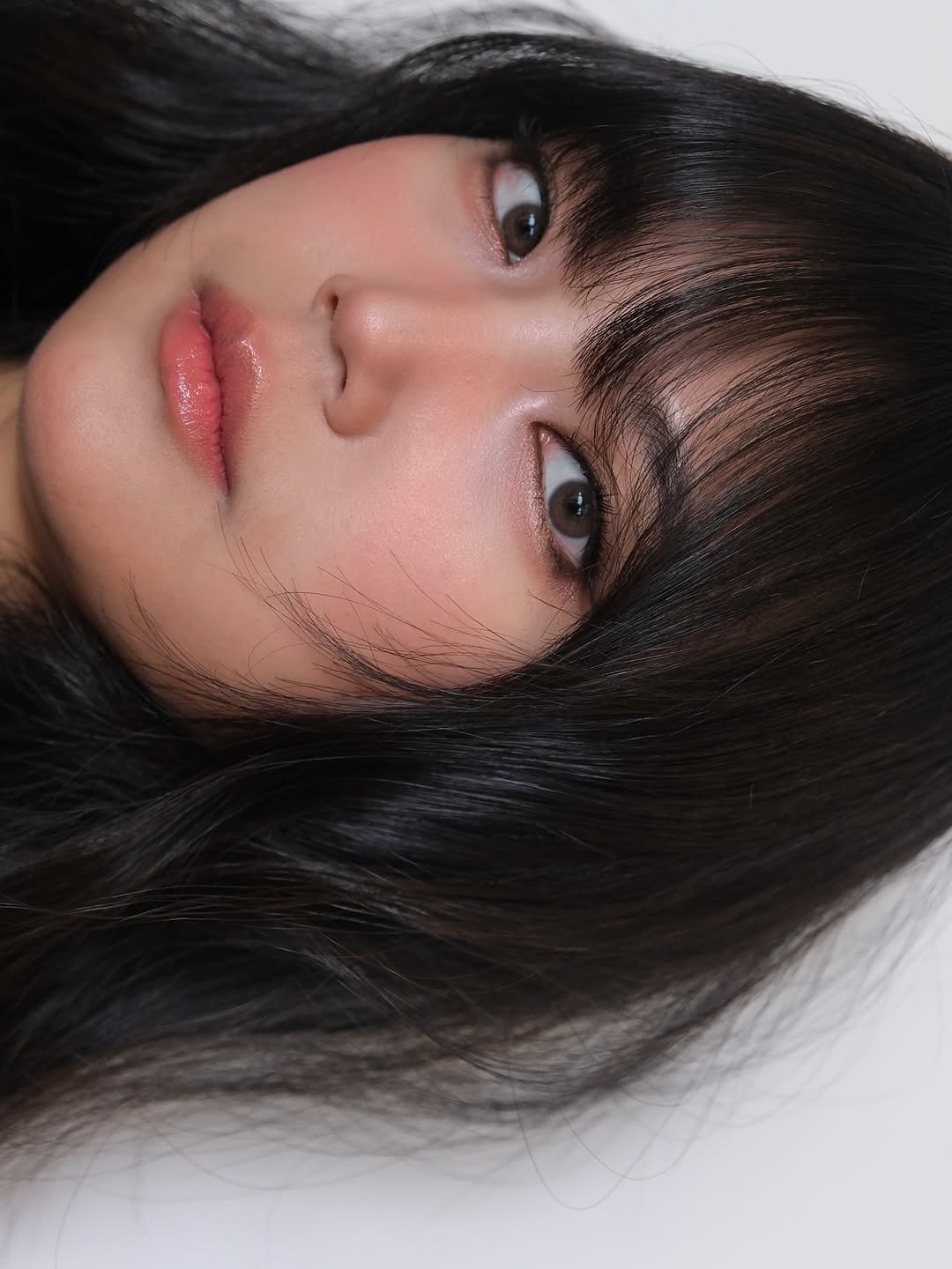 Photo shared by 이나 | Ena on August 09, 2025 tagging @pear1ena, and @enathin9. May be a closeup of 1 person, hair, eyeliner, makeup and text.