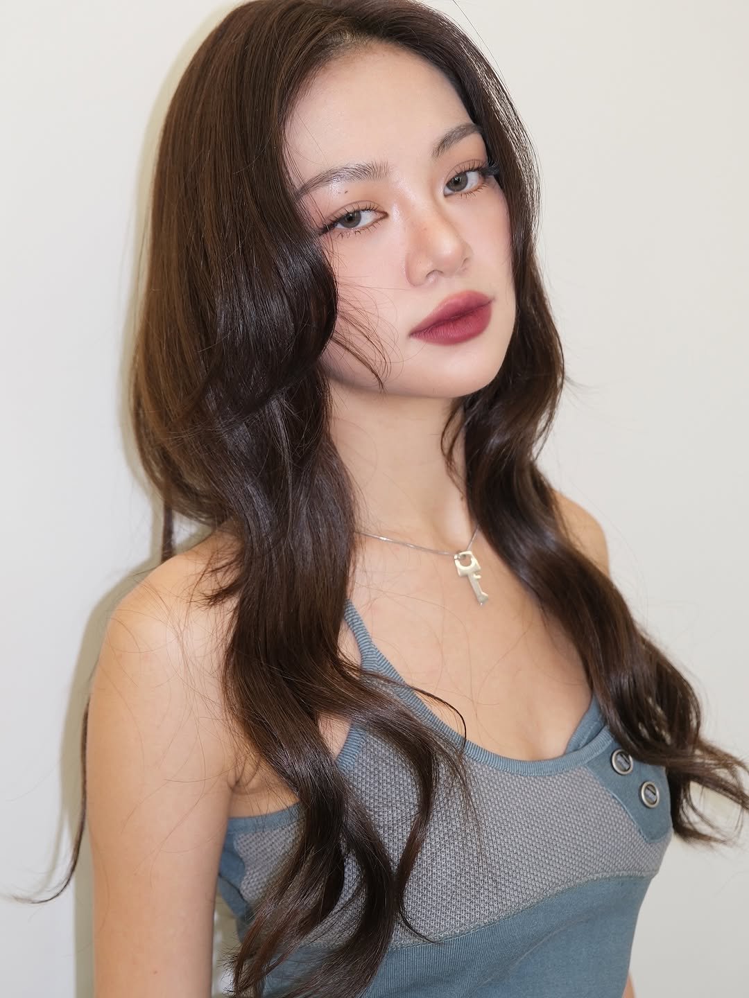 Photo shared by 이나 | Ena on October 08, 2025 tagging @pear1ena, and @enathin9. May be a closeup of one or more people, braids, long hair, makeup and text.