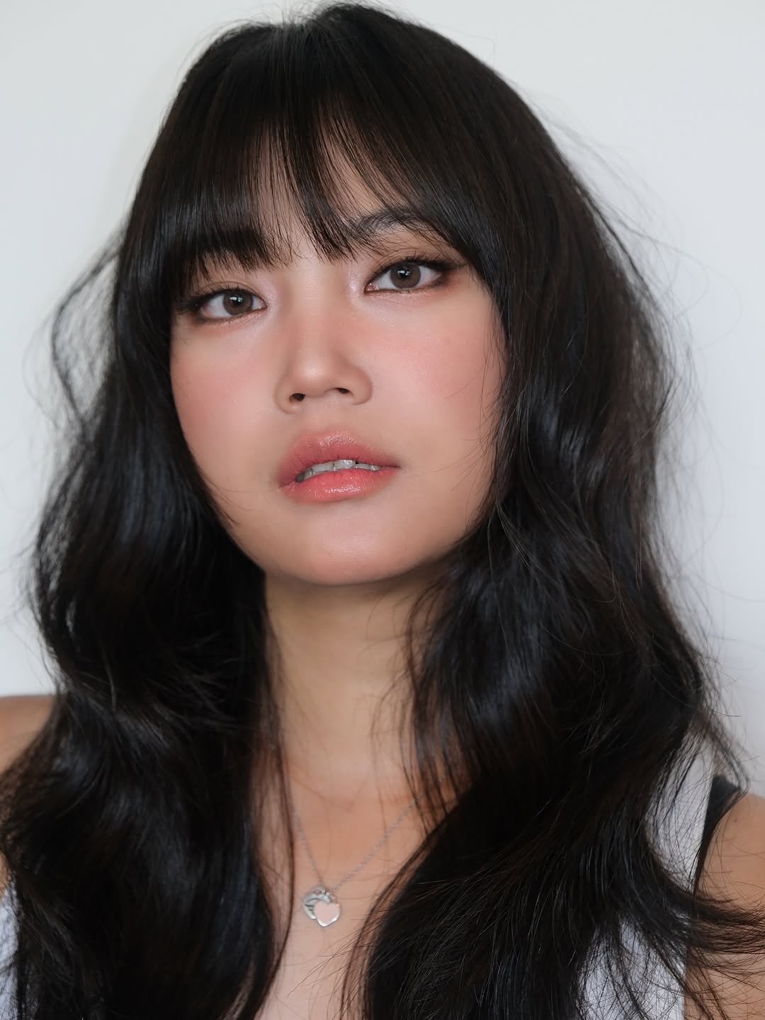 Photo shared by ENA | Korean Makeup Artist in Londonㅣ런던메이크업 on August 09, 2025 tagging @pear1ena, and @enathin9. May be a closeup of 1 person, bangs, makeup, eyeliner, lipstick and text.