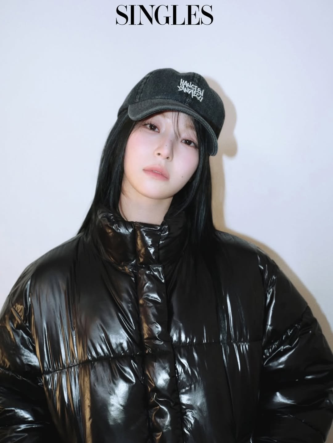 Photo shared by 이나 | Ena on November 27, 2025 tagging @singlesmagazine. May be an image of hat, goosedown coat, duffle coat, top, parka, flight jacket and text.