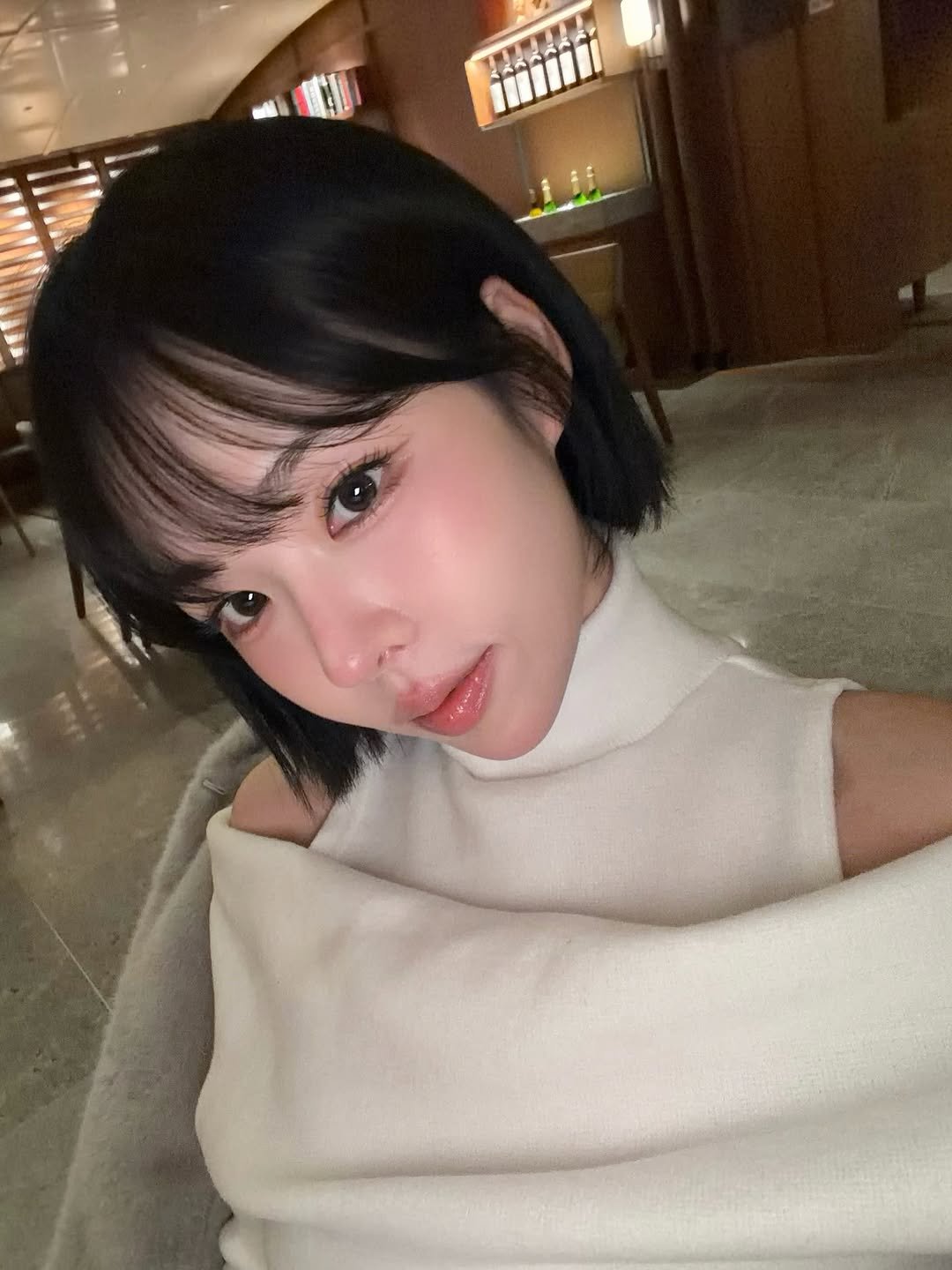 Photo shared by 이나 | Ena on December 23, 2025 tagging @enathin9. May be a selfie of one or more people, bangs, turtleneck, night and text.