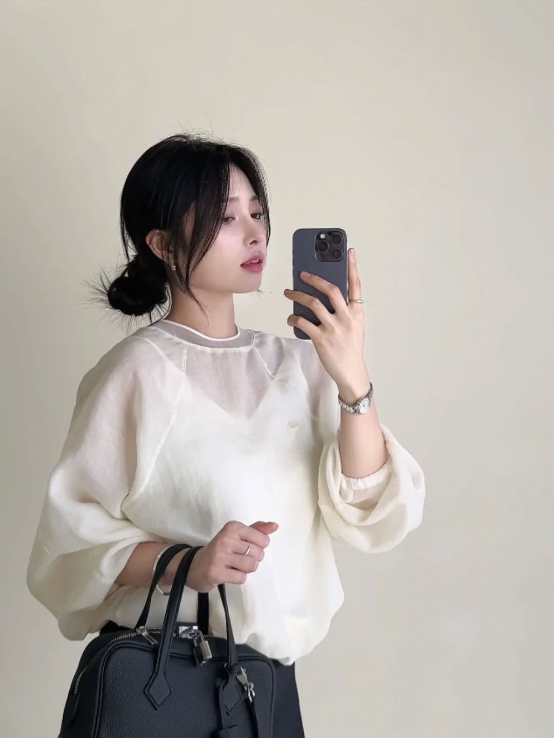 Photo by PECAN 피칸 on September 25, 2025. May be an image of 1 person, top, purse and text.