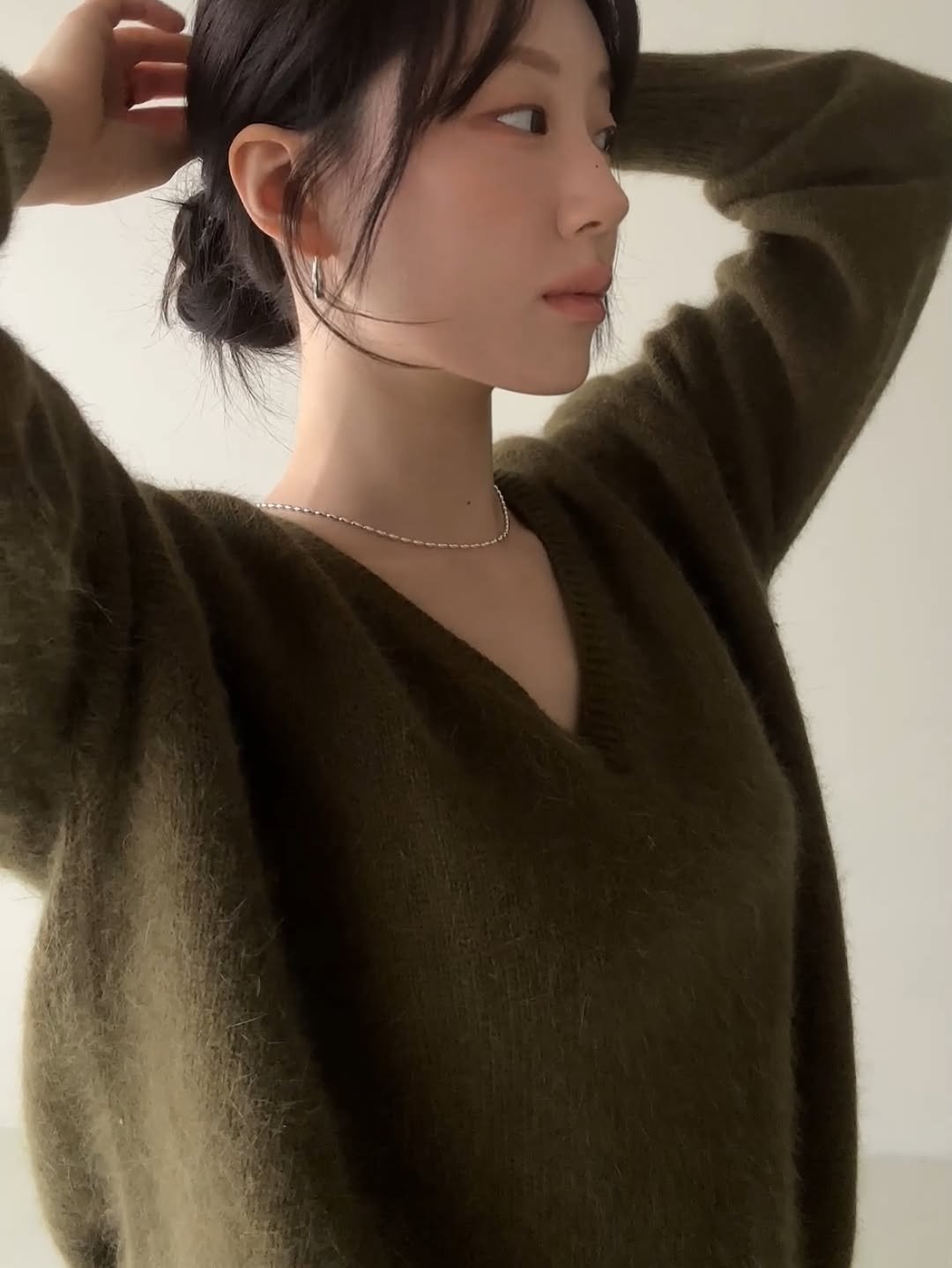 Photo by PECAN 피칸 on December 15, 2025. May be an image of one or more people, hair, top, turtleneck, sweater, knit and text.