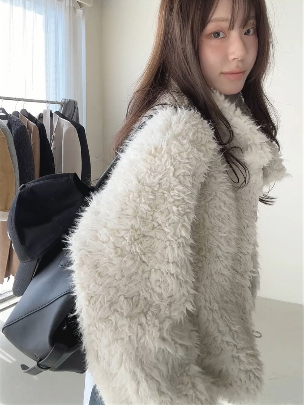 Photo by PECAN 피칸 on November 02, 2025. May be an image of one or more people, hair, duffle coat, sable coat, goosedown coat, jacket, parka, cardigan, top and text.