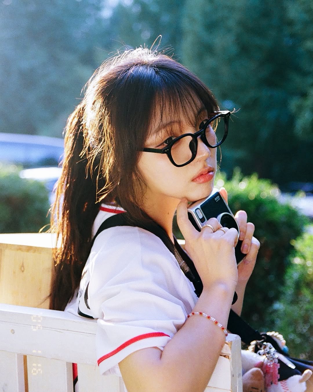Photo shared by 이선우 on October 01, 2025 tagging @oygnue. May be an image of 1 person, bangs, eyeglasses, miniskirt, outdoors and text.