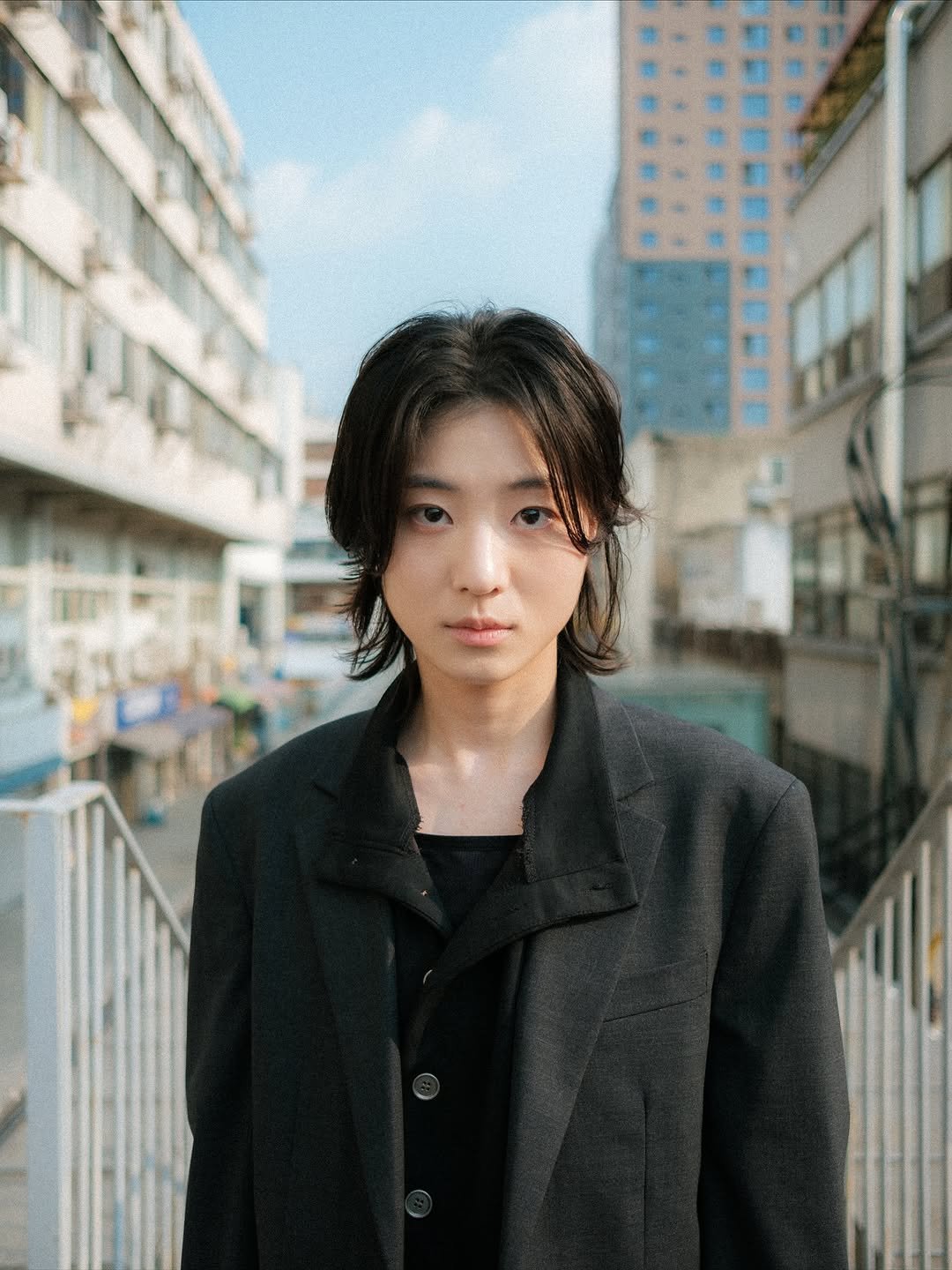 Photo by 이선우 on September 22, 2025. May be an image of 1 person, hair, duffle coat, blazer and text.