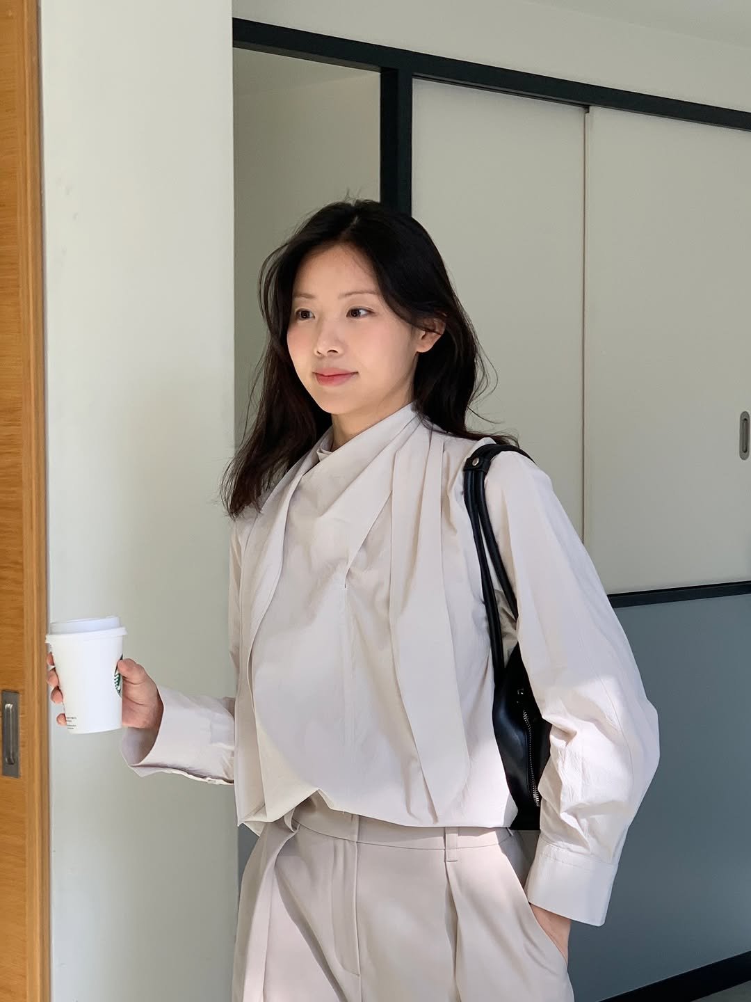 Photo by 루피타 LUPITA on March 10, 2026. May be an image of overcoat, blazer, suit, cornflower and text.