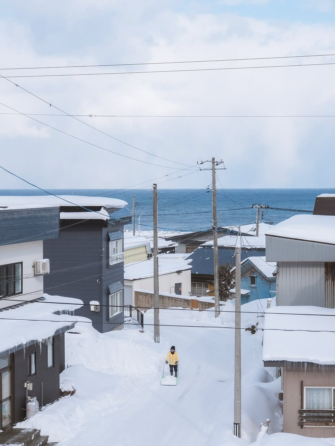 Photo shared by pilsung on November 25, 2025 tagging @japan.explores. May be an image of arctic, ski slope, telephone pole, snow and text.