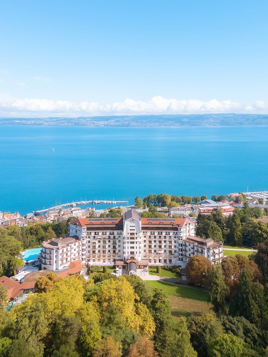 Photo shared by pilsung on September 21, 2025 tagging @explorefrance, @eviantourisme, @auvergnerhonealpes.tourisme, and @hotelroyalevian. May be an image of lake and text.