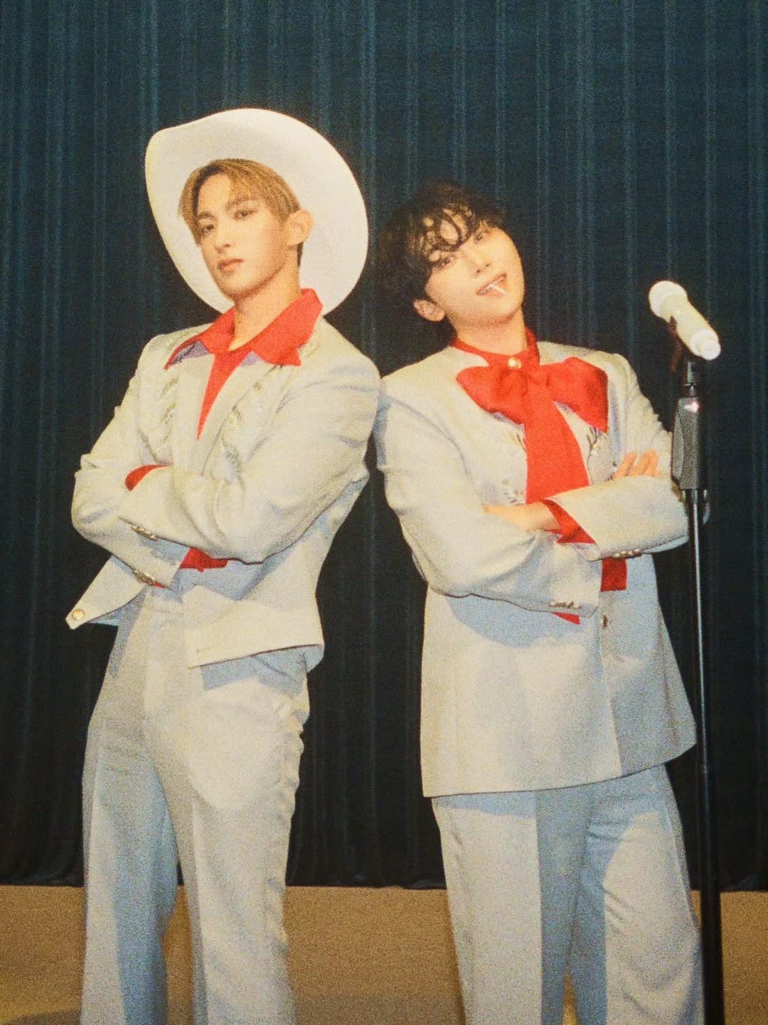 Photo by 승관 SEUNGKWAN on December 20, 2025. May be an image of one or more people, bangs, costume, bolo tie, suit, bandanna and text.