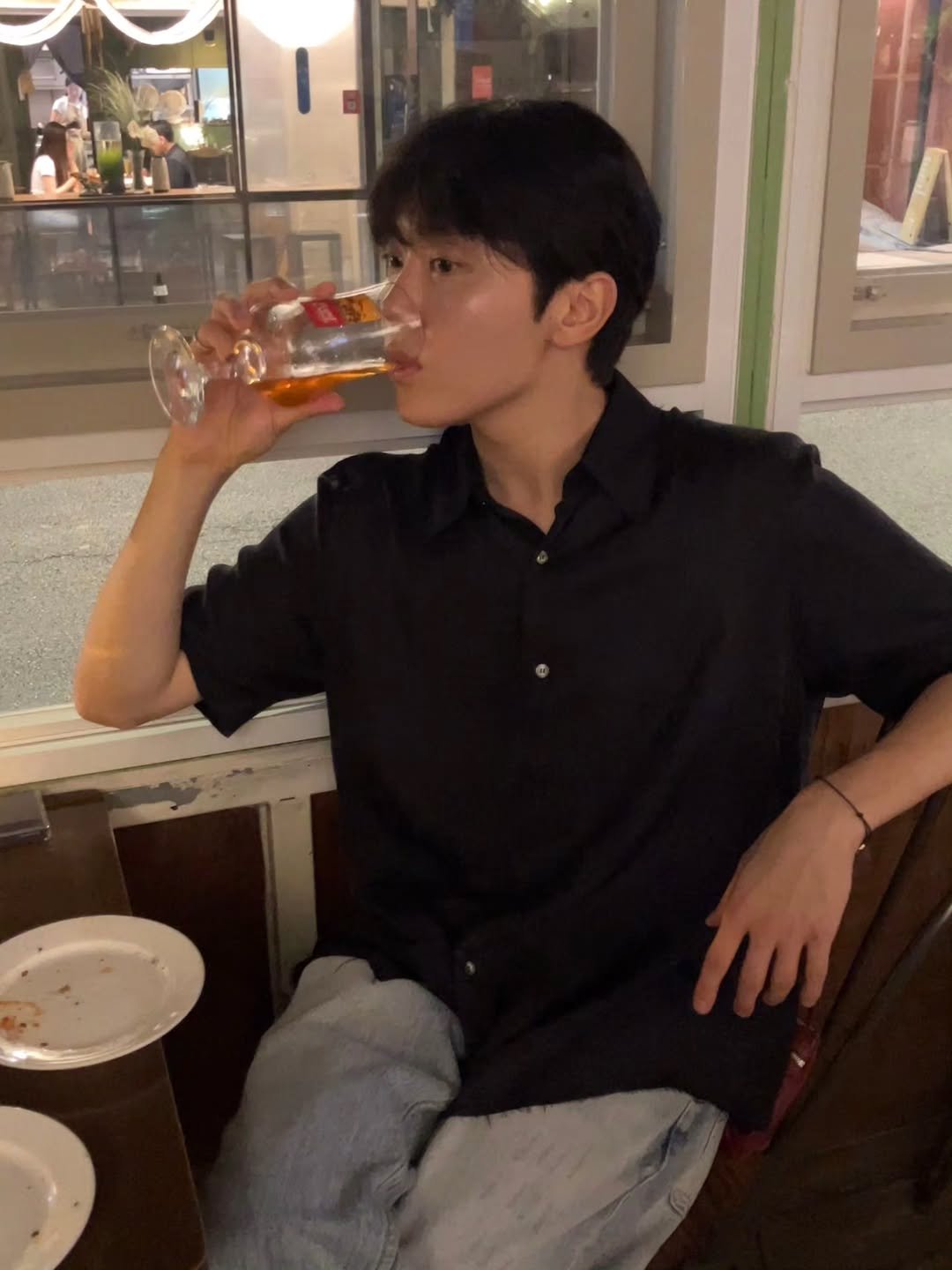 Photo by 승관 SEUNGKWAN on September 18, 2025. May be an image of one or more people, hair, beer and night.