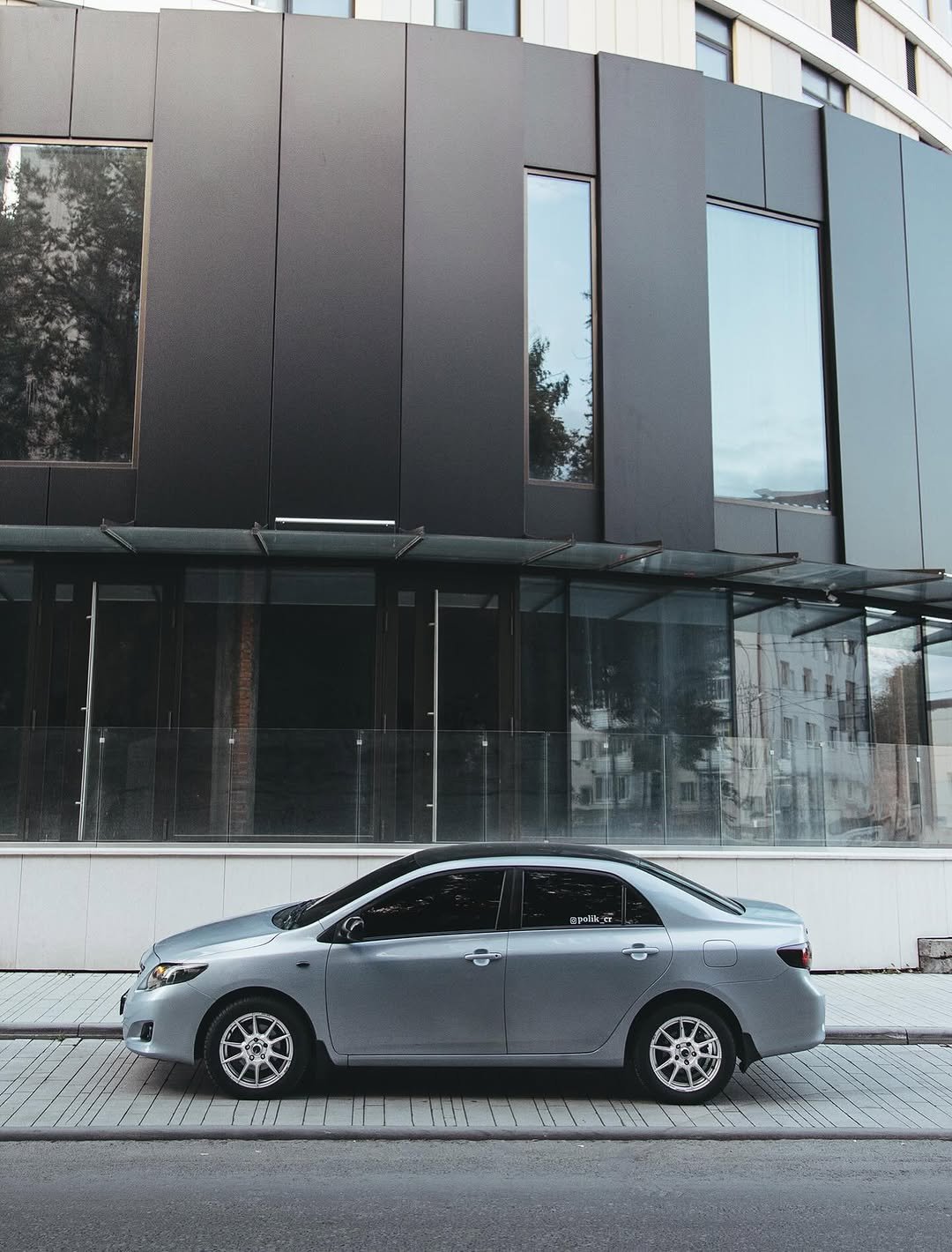 Photo by ПОЛИК on September 22, 2025. May be an image of sedan, buildings, window and text.
