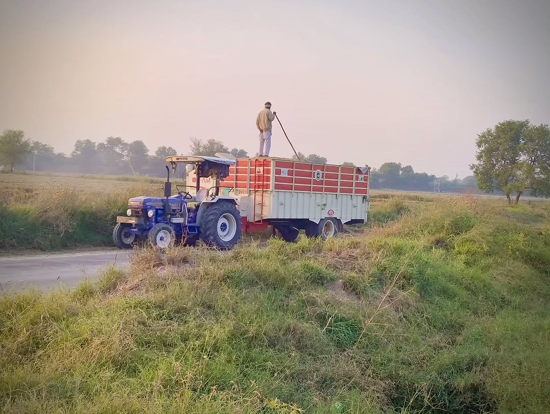 Photo by Poonia Krishi Farm on November 07, 2025. May be an image of combine, flag, tractor and text.