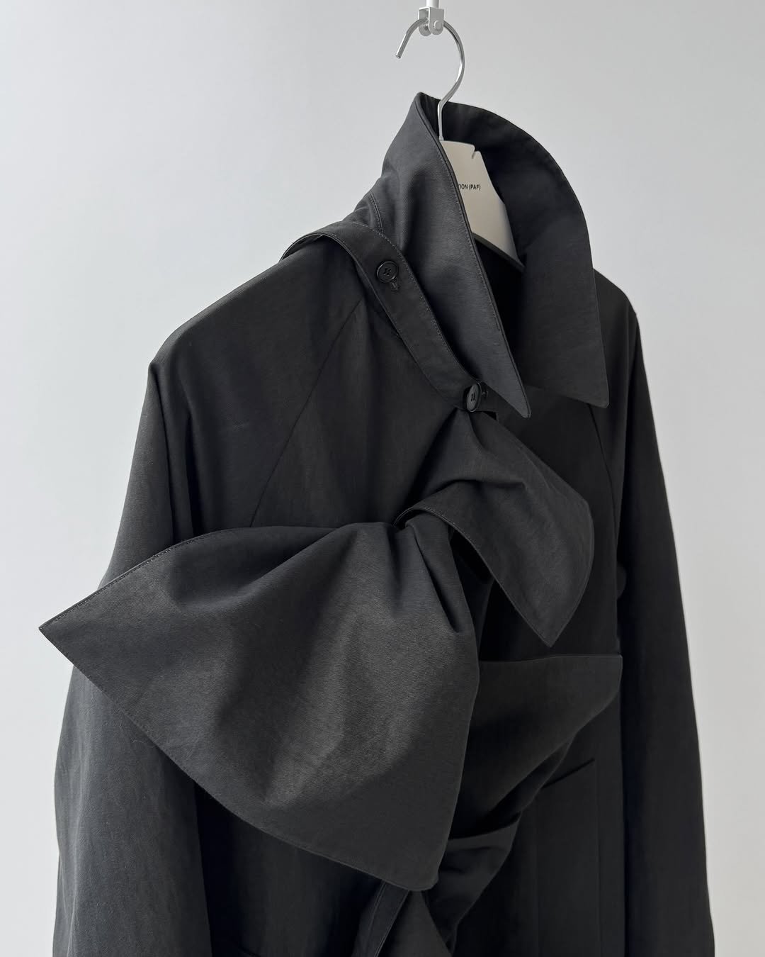 Photo by POST ARCHIVE FACTION (PAF) on February 23, 2026. May be an image of duffle coat, overcoat, jacket, cloak, parka and text.