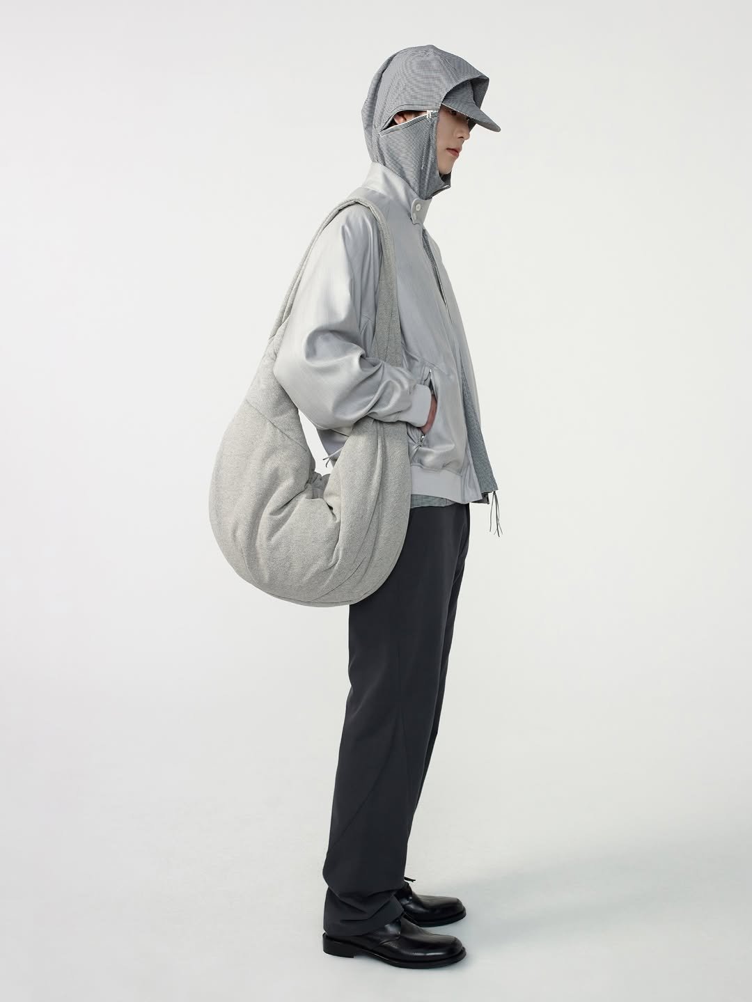 Photo by POST ARCHIVE FACTION (PAF) on April 28, 2026. May be an image of duffle coat, overcoat, hat, goosedown coat, parka, fleece, jacket, drawstring and text.