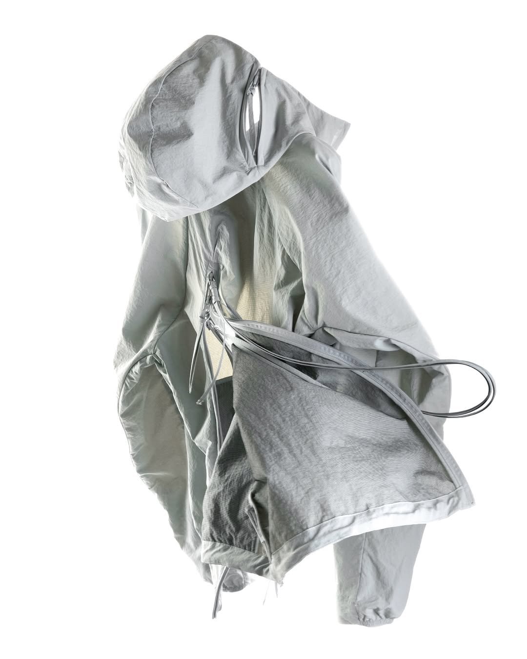 Photo by POST ARCHIVE FACTION (PAF) on February 19, 2026. May be an image of drawstring, raincoat, parka, sportswear, jacket and text.