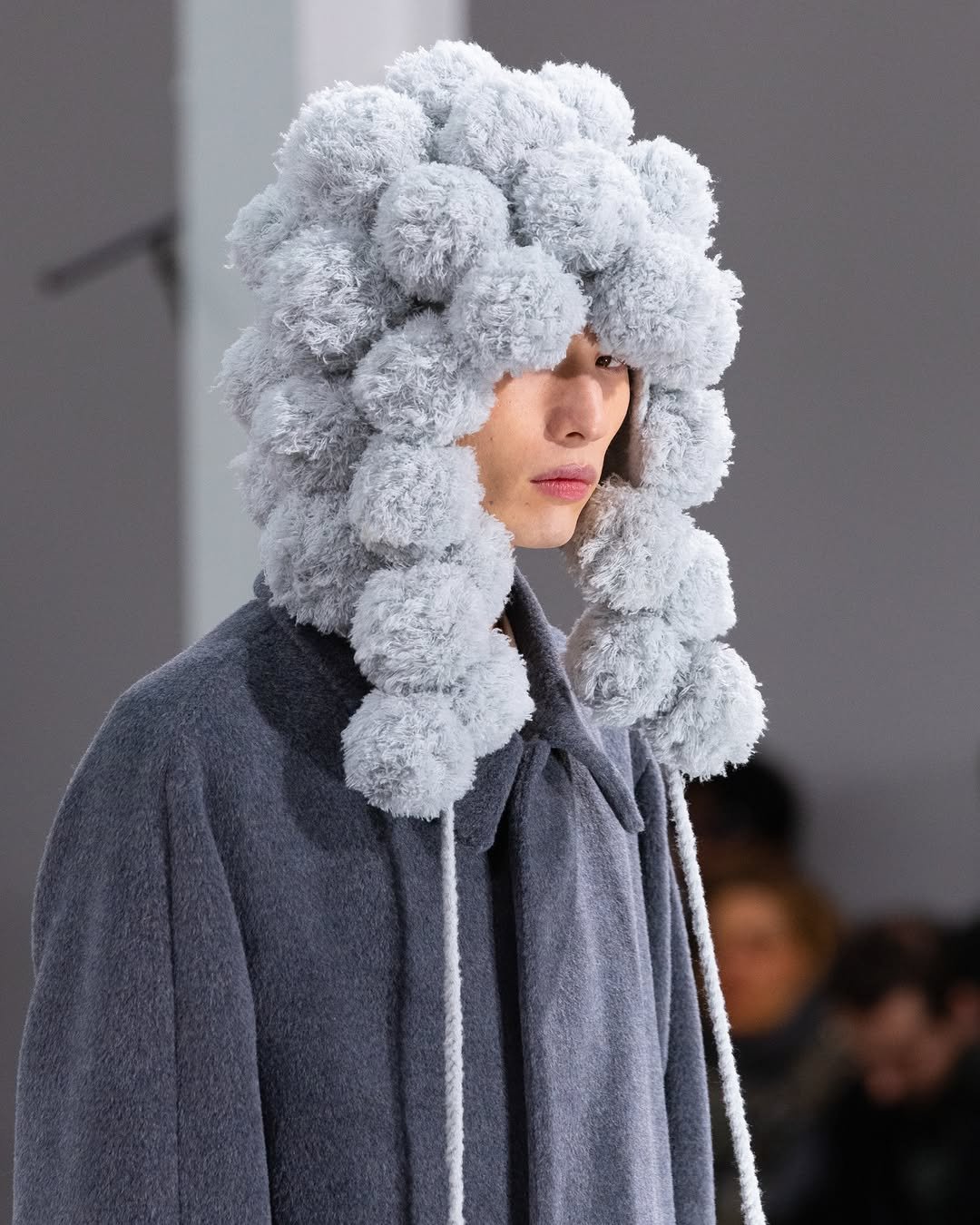 Photo by POST ARCHIVE FACTION (PAF) on January 31, 2026. May be an image of overcoat, fur, wool and text.