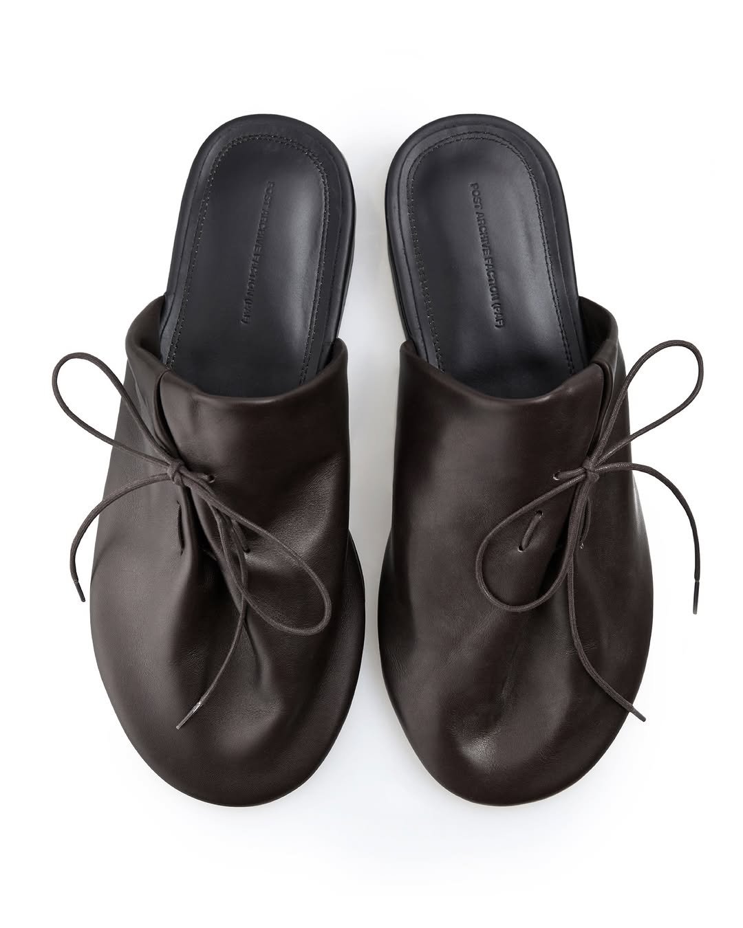 Photo by POST ARCHIVE FACTION (PAF) on March 19, 2026. May be an image of leather, sandals, slingback shoes and text.