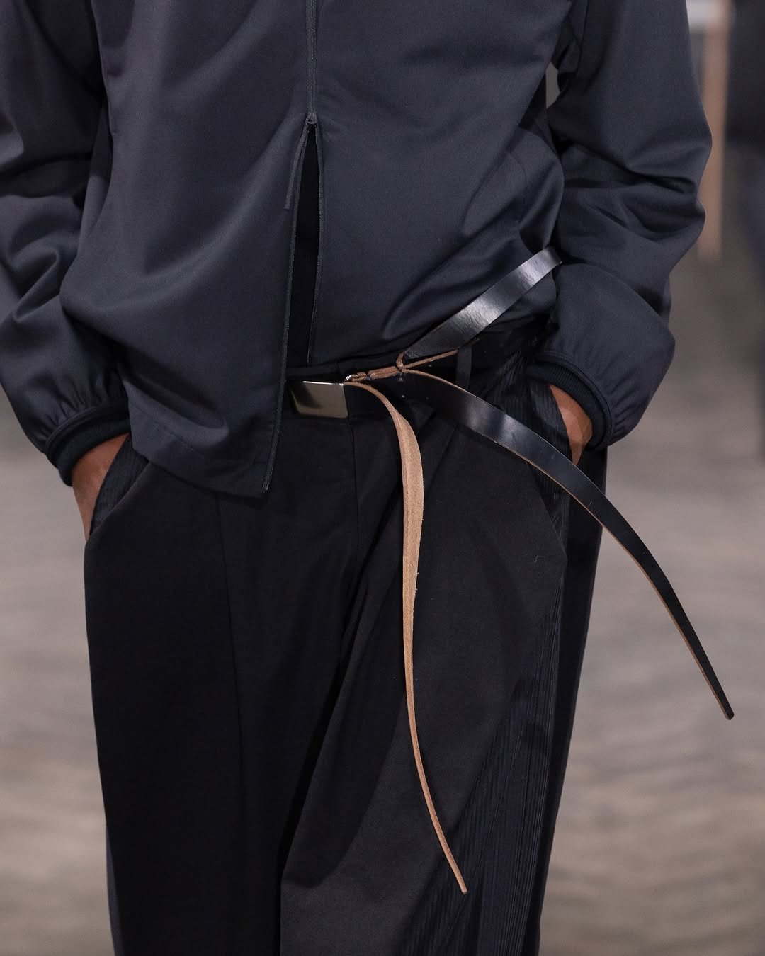 Photo by POST ARCHIVE FACTION (PAF) on January 31, 2026. May be an image of outerwear, belt and text.