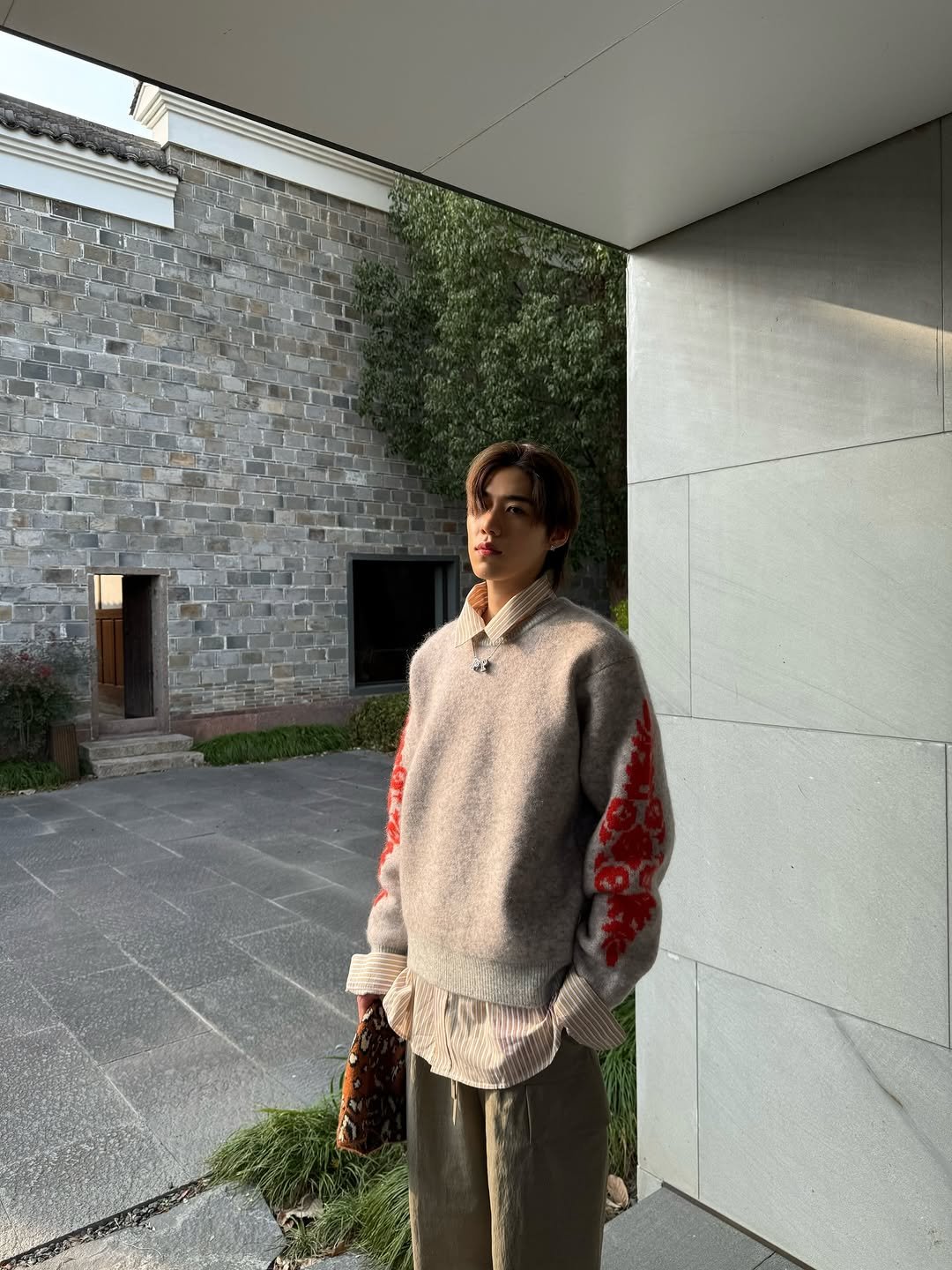 Photo by Krit Amnuaydechkorn on December 02, 2025. May be an image of turtleneck, sweater and text.