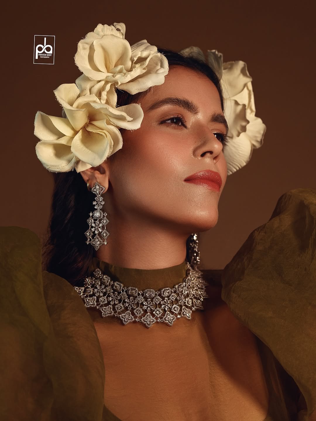 Photo shared by Praveen Bhat Photography on August 09, 2025 tagging @praveenbhatphotography. May be an image of 1 person, makeup, choker, headdress, magazine and text.