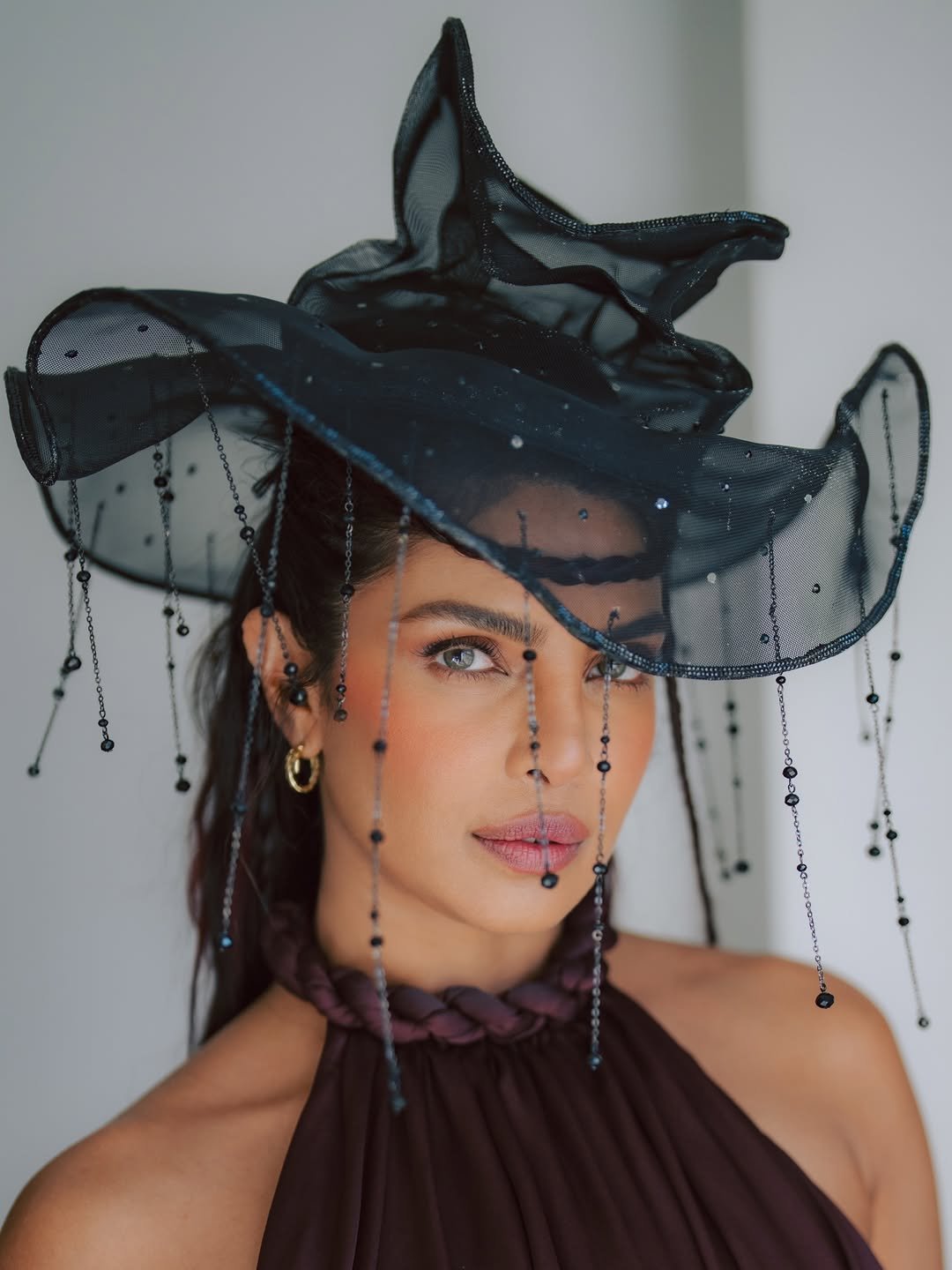 Photo shared by Priyanka on February 21, 2026 tagging @morgane_martini, @krimesh, @kimmiekyees, @bridgetbragerhair, @alexpardashian, @bvlgari, and @waymanandmicah. May be an image of one or more people, makeup, hat, headdress and text.