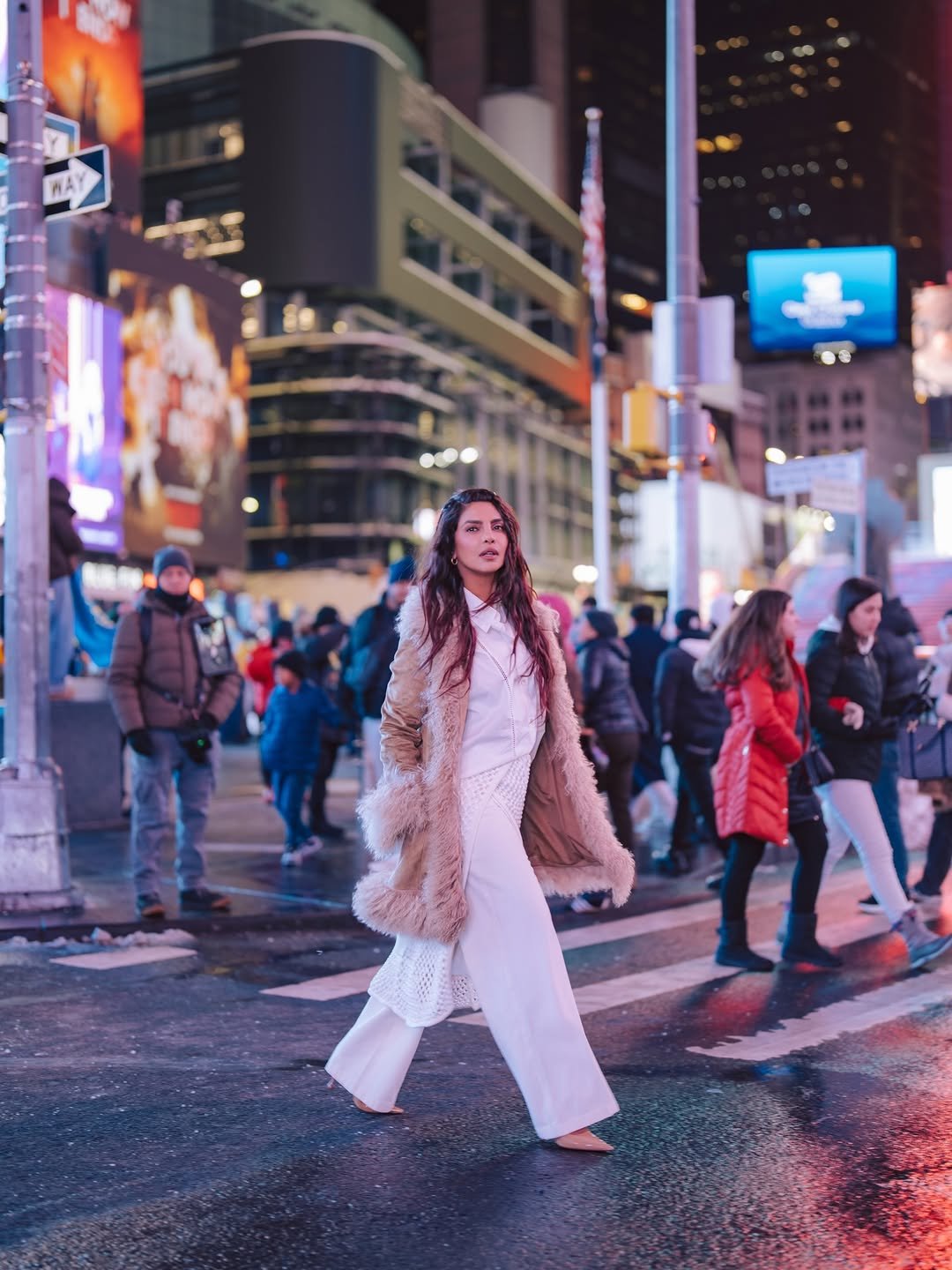 Photo shared by Priyanka on February 27, 2026 tagging @morgane_martini, @krimesh, @charlottesimone, @hannan.siddique, @harryjoshhair, @waymanandmicah, and @diotima.world. May be an image of standing, overcoat, Times Square, street and text.