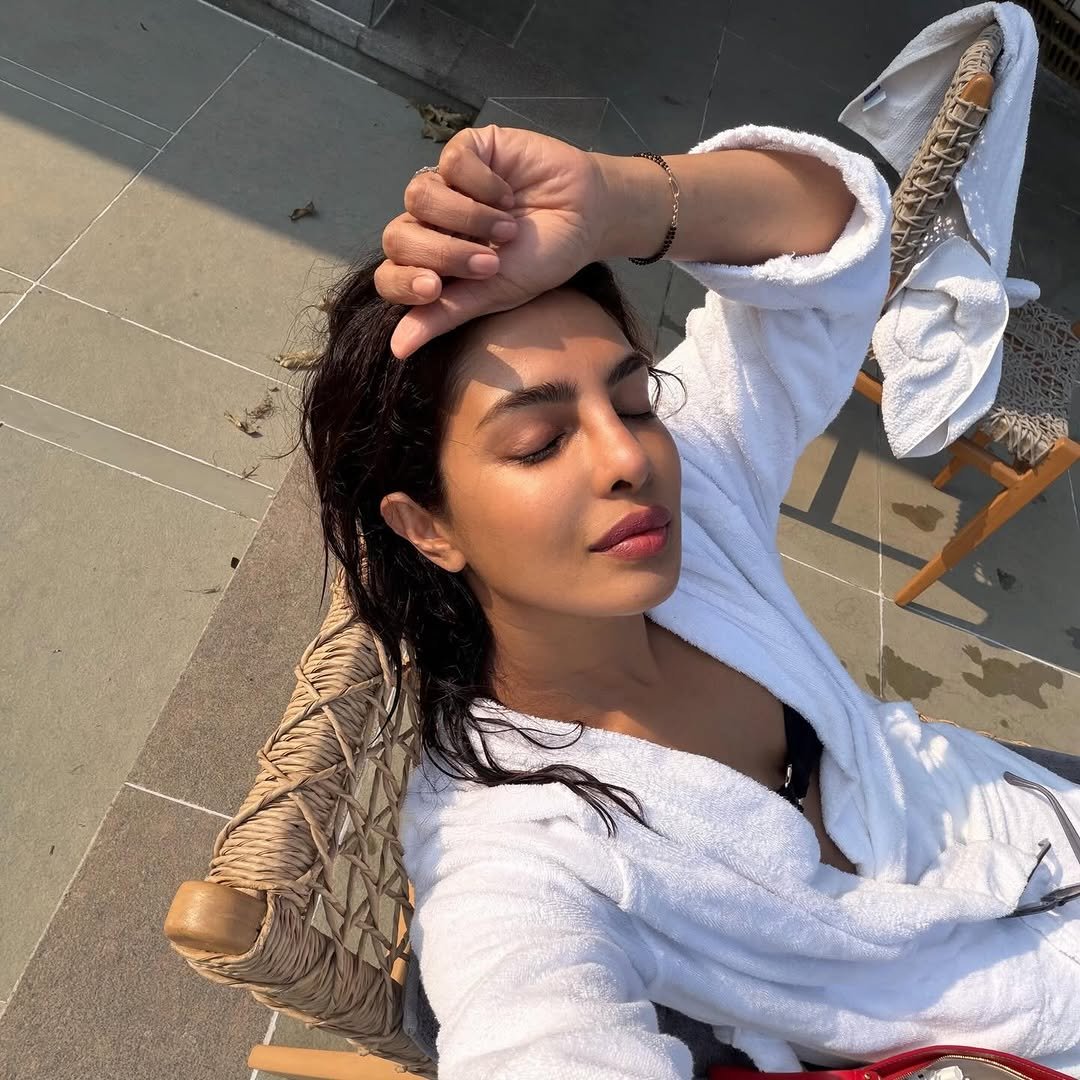 Photo by Priyanka on April 06, 2026. May be an image of one or more people, hair, makeup, deck chair, bath robe, robe, pool and text.