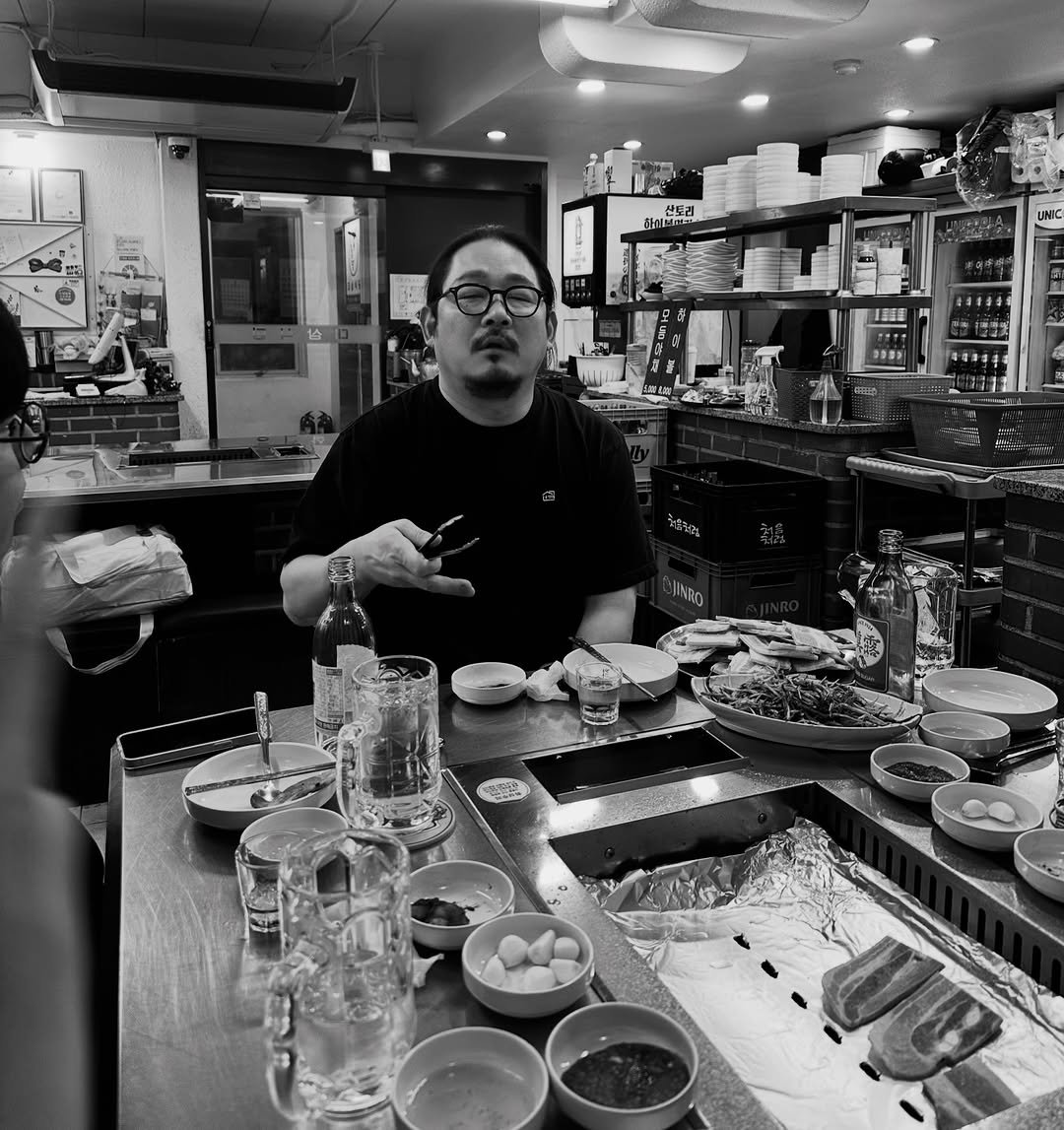 Photo shared by 하정석 on January 22, 2026 tagging @projectsyun. May be a black-and-white image of sushi, chopsticks and text.