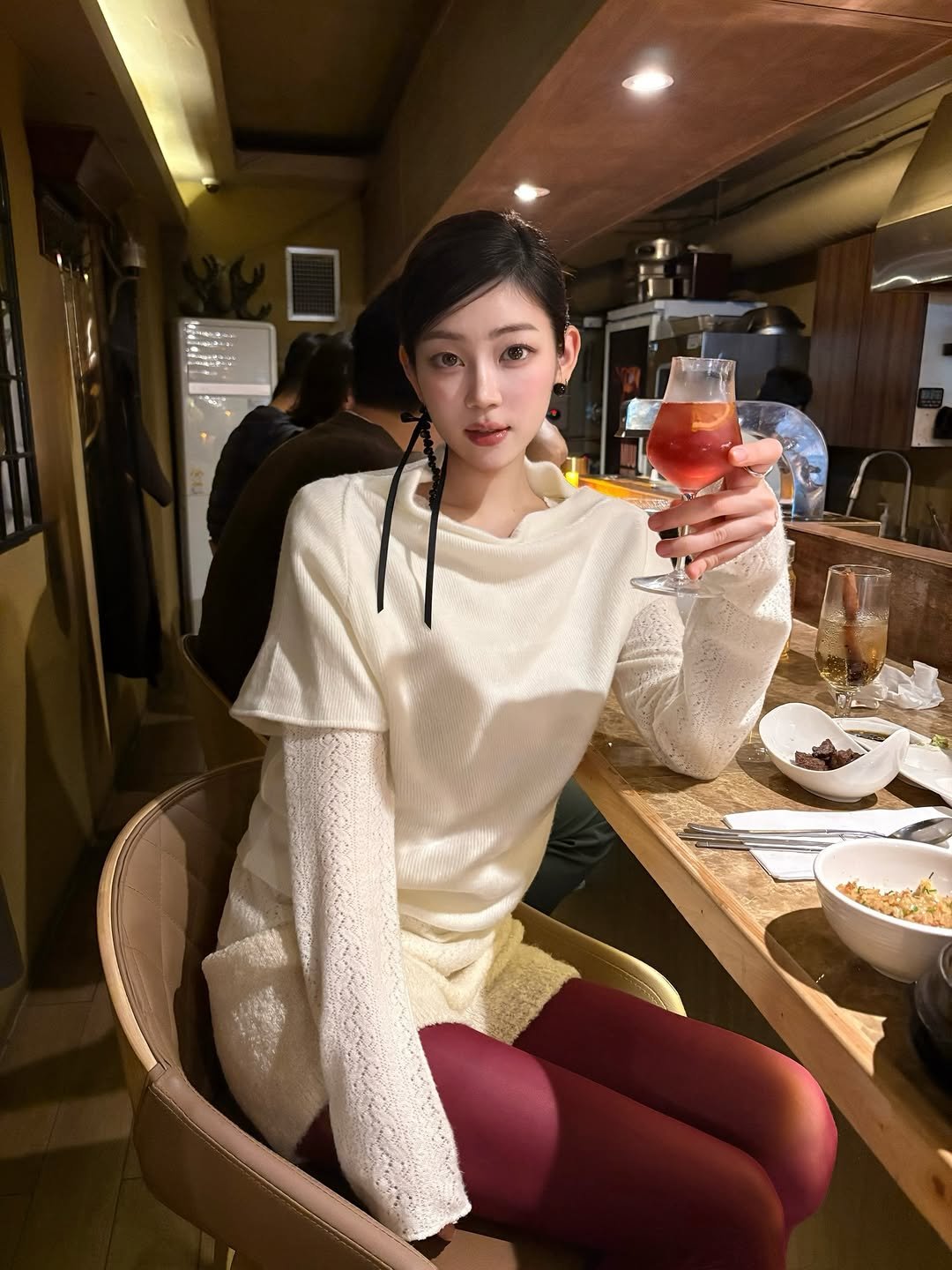 Photo shared by 황지현 on December 22, 2025 tagging @thebarnnet, @eutosis, and @poe_wedding. May be an image of drink, turtleneck, top, knit and text.