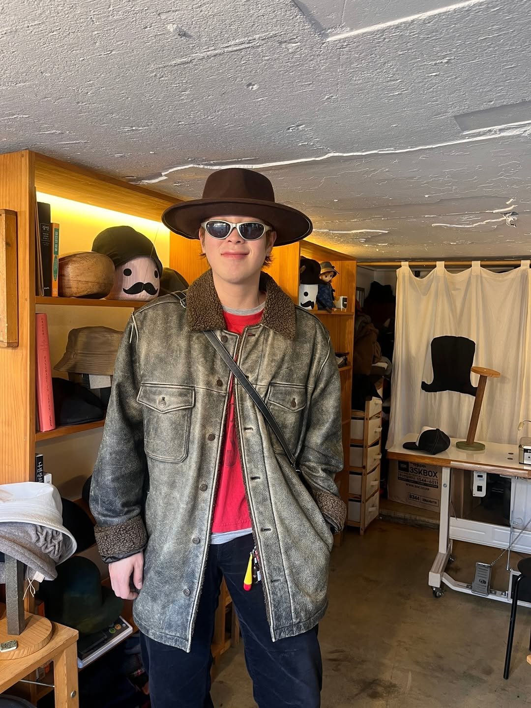 Photo by P.O on March 15, 2026. May be an image of hat, duffle coat, overcoat, bowler hat, hat shop and text.