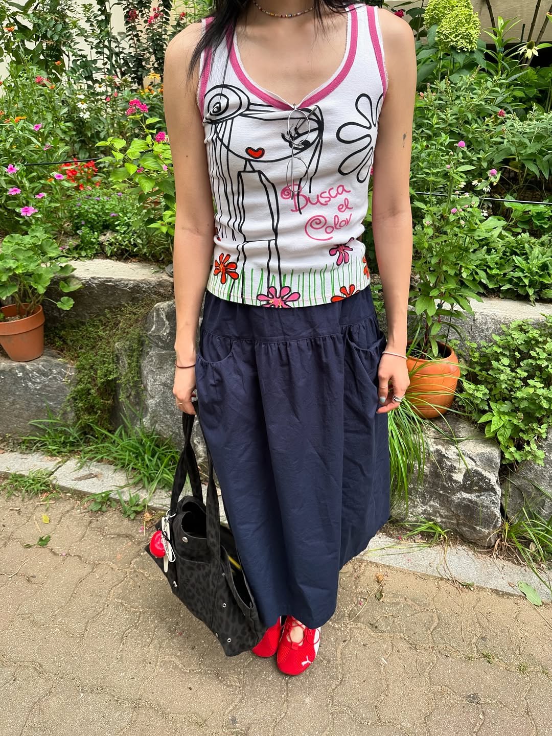 Photo by 소연 Soyeon on August 10, 2025. May be an image of 1 person, sundress, skirt and text.