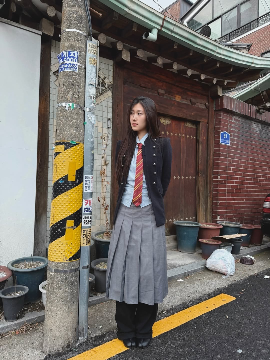 Photo by 소연 Soyeon on January 13, 2026. May be an image of duffle coat, Fushimi Inari Taisha and text.