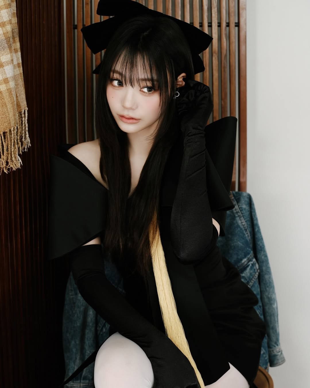 Photo by QWER on April 16, 2026. May be an image of one or more people, hair, costume and text.