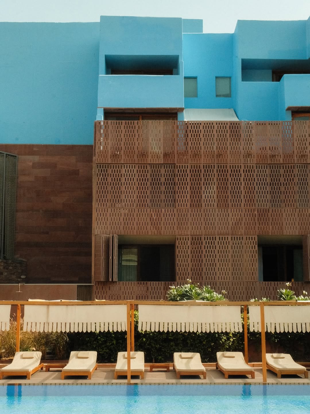 Photo by RAAS Hotels on February 21, 2026. May be an image of pool, buildings and text.