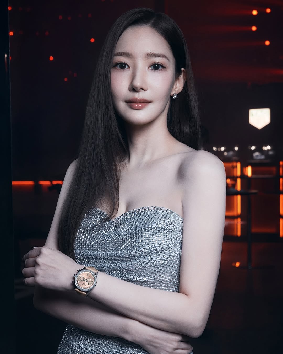 Photo shared by TAG Heuer on June 28, 2025 tagging @rachel_mypark. May be an image of one or more people, hair, makeup, wrist watch, top and text.