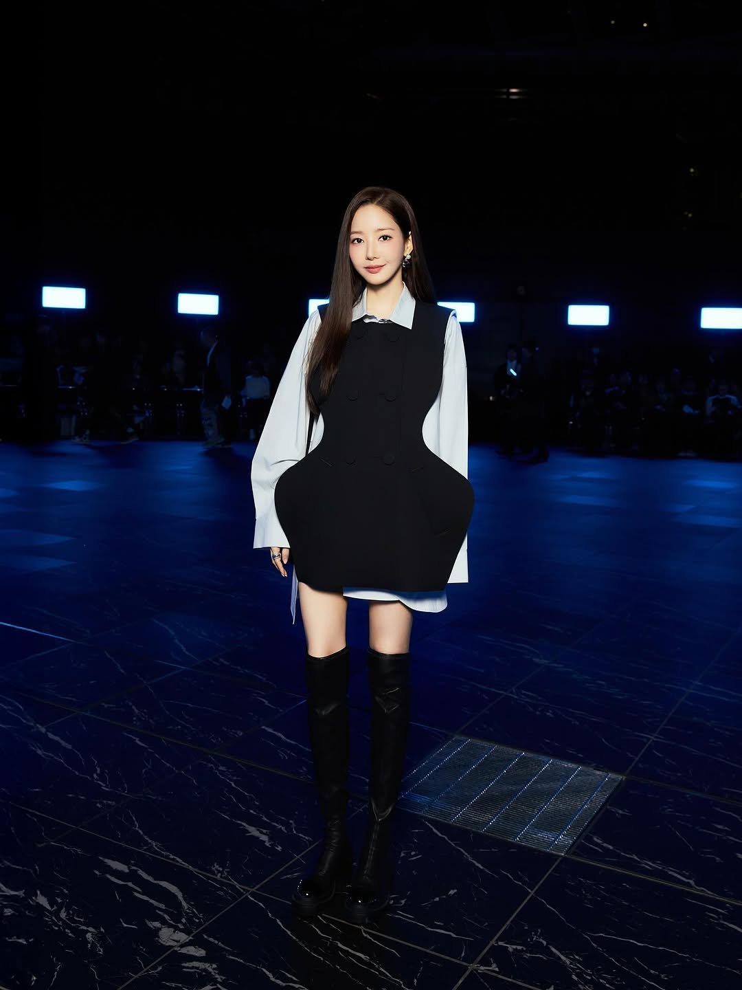 Photo shared by ENFÖLD on November 07, 2025 tagging @rachel_mypark. May be an image of one or more people, makeup, hair, dress, miniskirt and text.