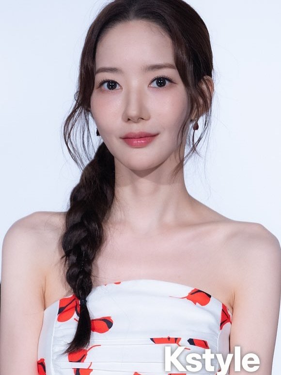 Photo by 박민영 Park Min Young on September 05, 2025. May be an image of 1 person, braids, makeup, top, dress, halter top and text that says 'Kstyle'.