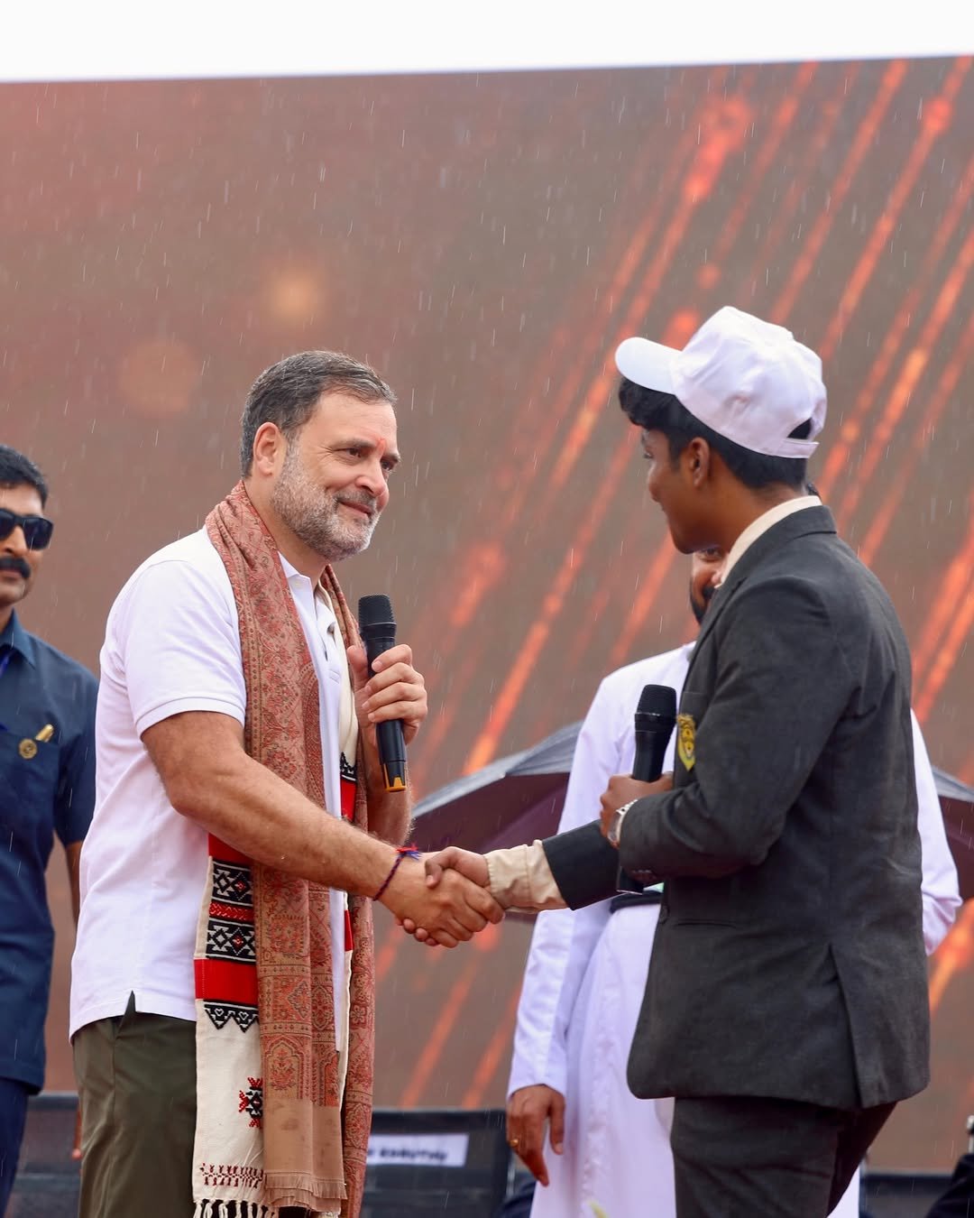 Photo shared by Rahul Gandhi on January 13, 2026 tagging @incindia. May be an image of one or more people, people standing, dais and text.