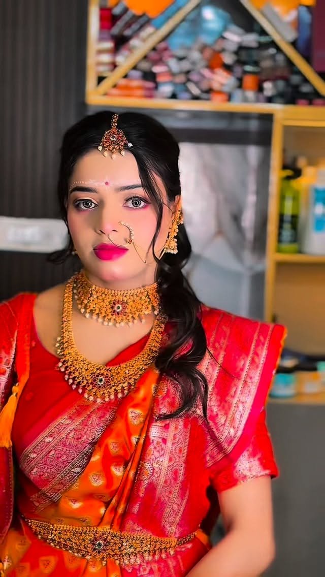 ranchi_loukia_salon 게시물 이미지: Draped in red, crowned in gold, and wearing a...
