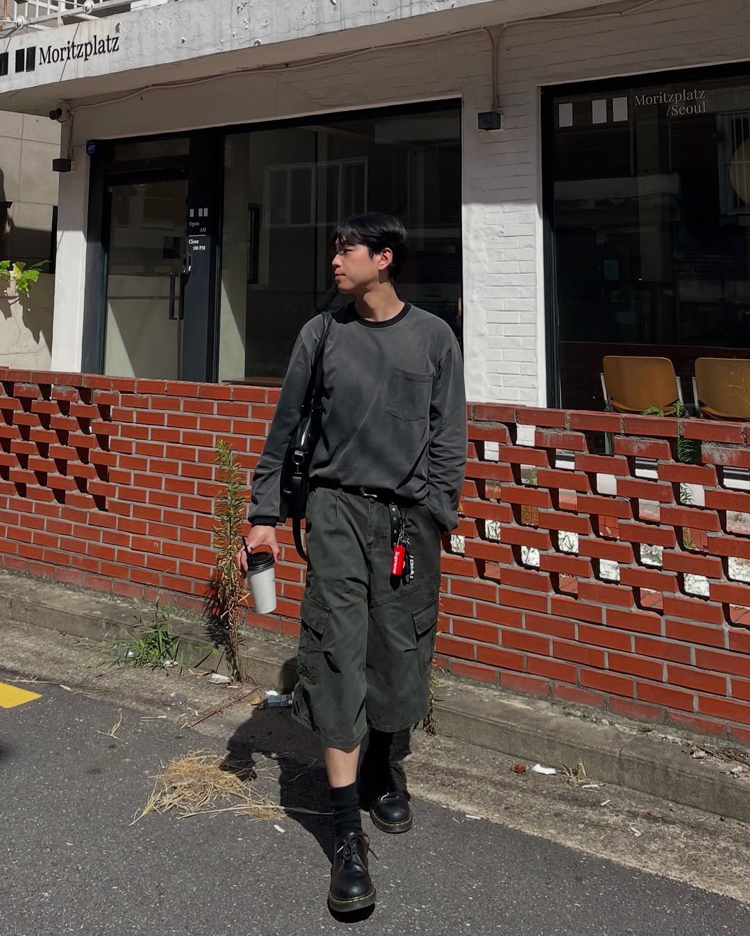 Photo shared by 데일리 패션 레슬 on August 06, 2025 tagging @recordy.slow. May be an image of 1 person, duffle coat and text that says 'Moritz Moritzplatz'.